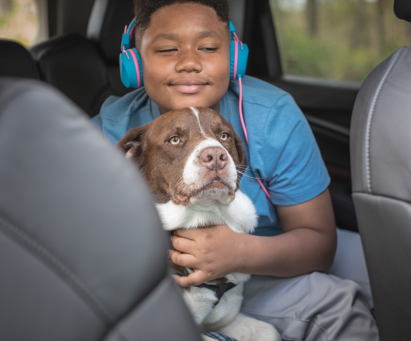 Lifestyle Photography by Jason Risner of a Boy and Rescue Dog For Valero