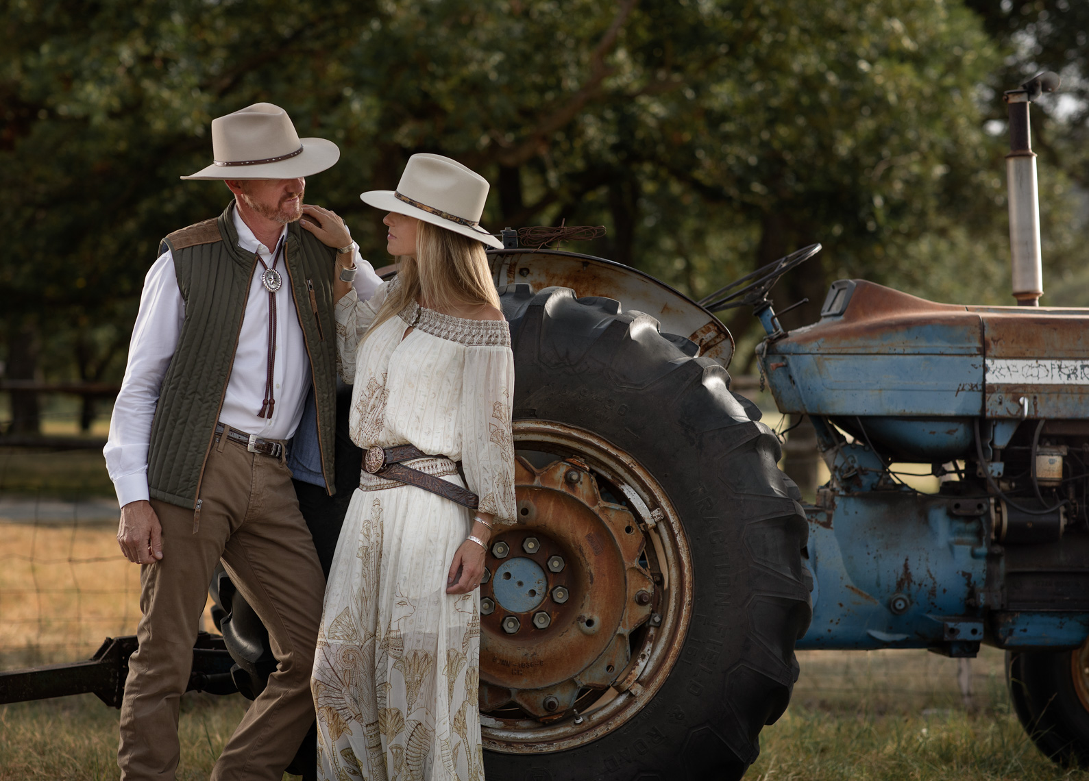 Couple Photographed In Front of Tractor by  Lifestyle Photographer Jason Risner 