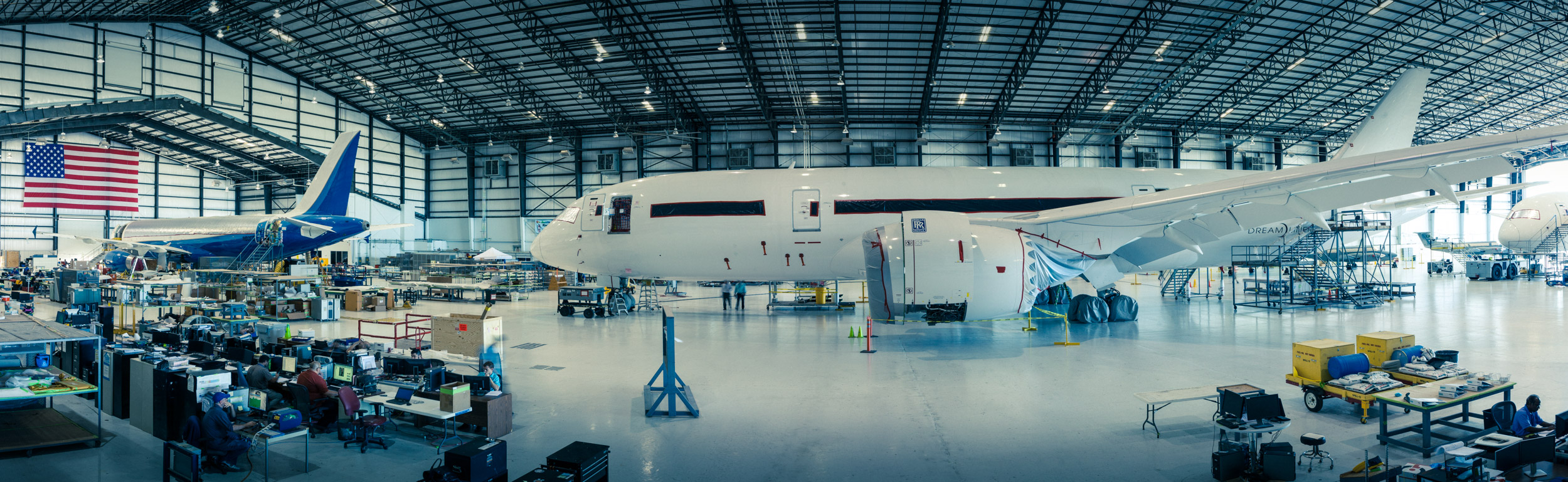 wide view of airplane in airport hangar