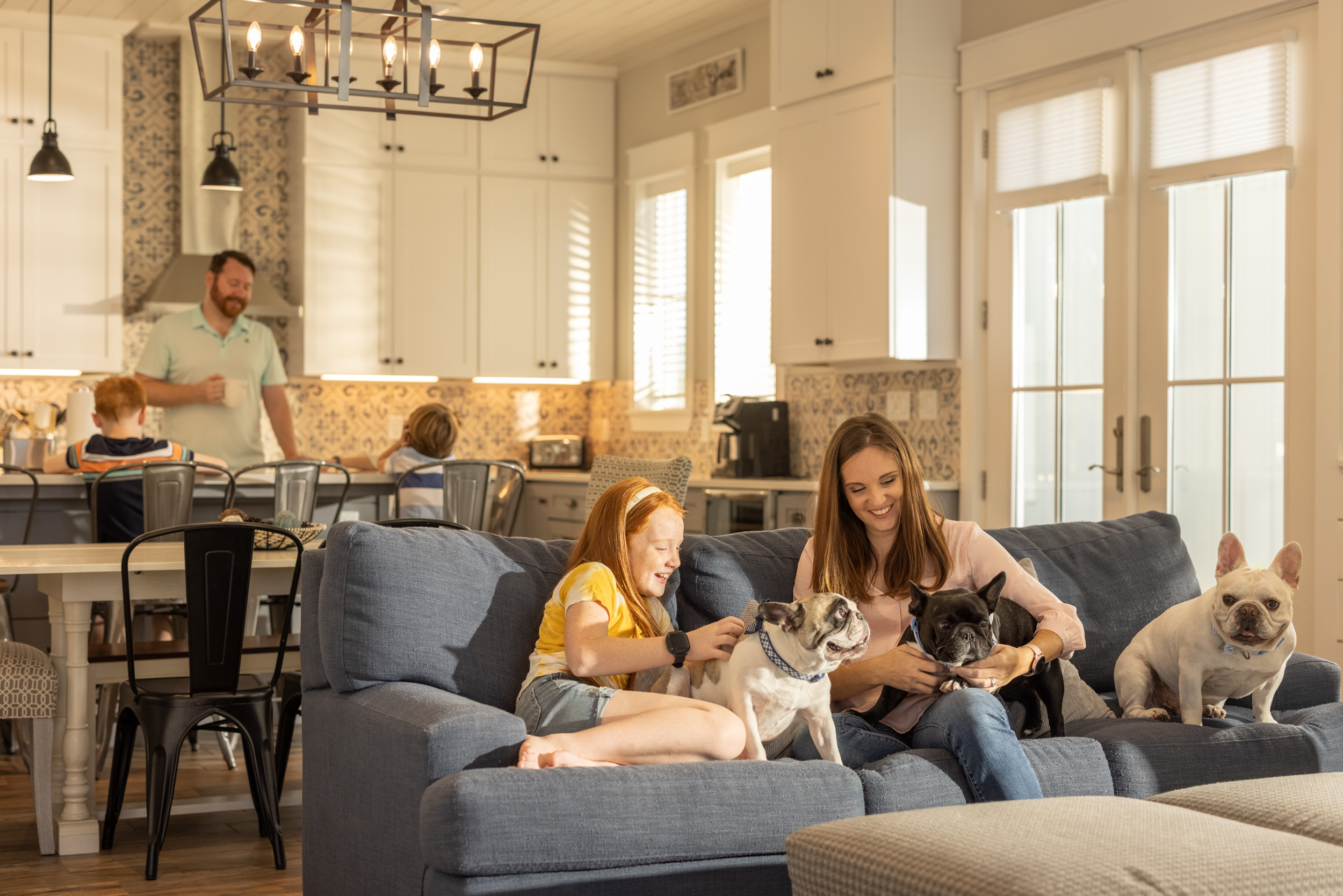 mother and daughter with dogs in living room
