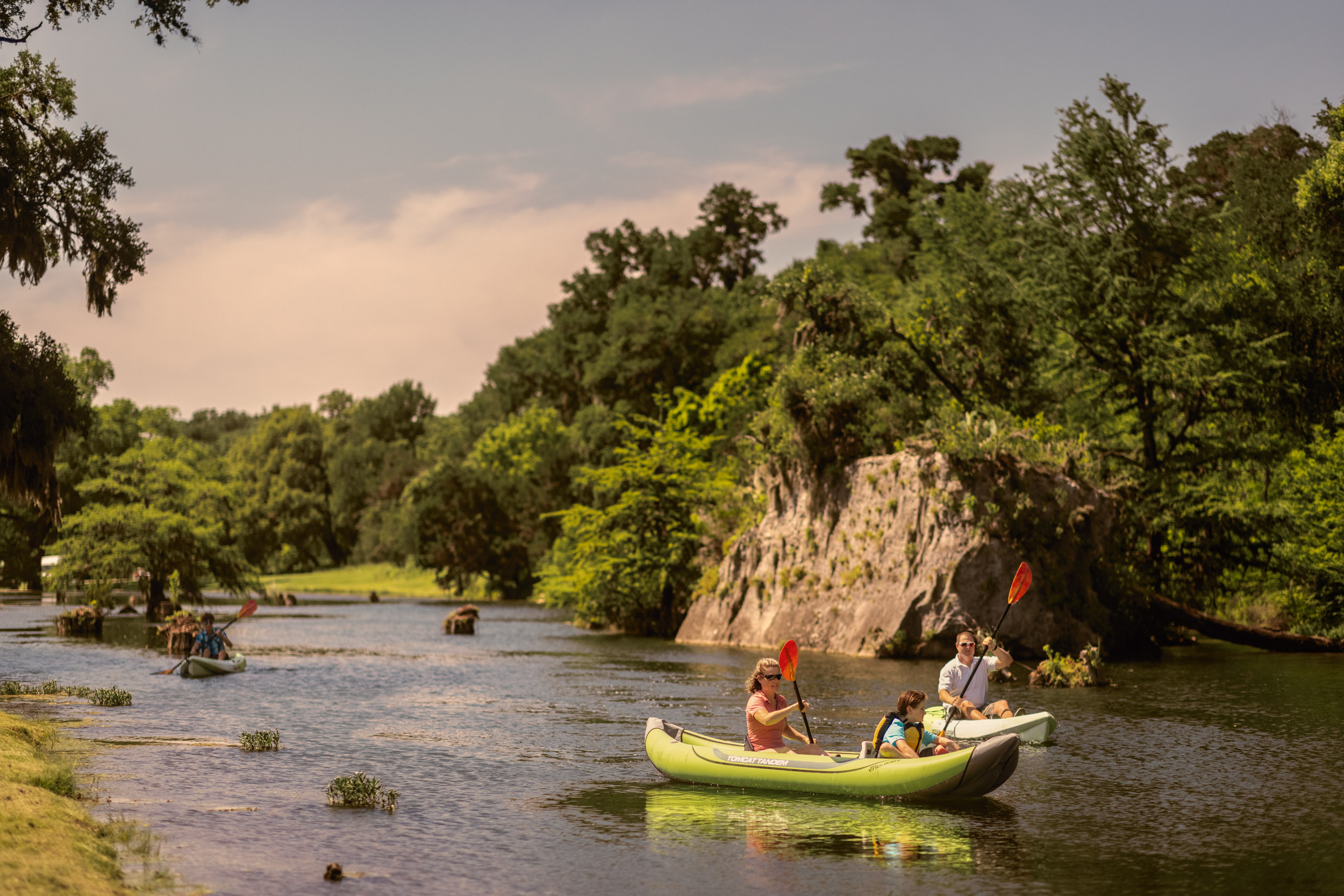 kayakers paddling down river in south texas