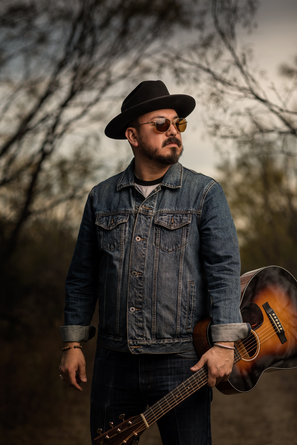 texas musician peter hererra holding guitar in del rio